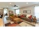 Bright living room featuring hardwood floors, comfortable furnishings, and abundant natural light at 9166 Lieven St, Avon, IN 46123
