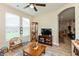 Bright living room features a ceiling fan, wooden furniture, and plenty of natural light at 9166 Lieven St, Avon, IN 46123
