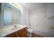 Clean bathroom with bath/shower combo, and wood cabinet vanity at 931 Wickham Ct # 101, Carmel, IN 46032