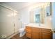 Bathroom featuring shower, wood vanity, and tile flooring at 931 Wickham Ct # 101, Carmel, IN 46032