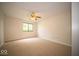 Bedroom with carpeted floor, ceiling fan, and natural light from window at 931 Wickham Ct # 101, Carmel, IN 46032