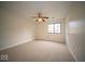 Large bedroom with fan, window, and carpeted floor at 931 Wickham Ct # 101, Carmel, IN 46032