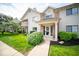 Inviting home exterior featuring a well-manicured lawn and charming architectural details at 931 Wickham Ct # 101, Carmel, IN 46032