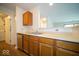 Bright kitchen with stainless dishwasher and sink, and wood cabinets at 931 Wickham Ct # 101, Carmel, IN 46032