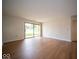 Bright living room with wood floors and a sliding glass door to outdoor space at 931 Wickham Ct # 101, Carmel, IN 46032