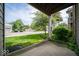 View from the patio showing the green lawn and trees in this neighborhood with surface parking at 931 Wickham Ct # 101, Carmel, IN 46032
