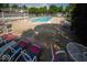 A stunning view of the community pool and deck providing a resort-like atmosphere for leisure and socializing at 931 Wickham Ct # 101, Carmel, IN 46032