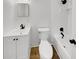 Clean bathroom with new fixtures, vanity, and a shower-tub combo at 9490 E 36Th Pl, Indianapolis, IN 46235