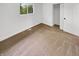 Clean bedroom with carpet floors, closet, window and fresh white paint at 9490 E 36Th Pl, Indianapolis, IN 46235