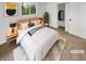 Cozy bedroom featuring a neutral color palette, closet, and soft rug. (Virtually Staged) at 9490 E 36Th Pl, Indianapolis, IN 46235