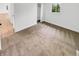 Bedroom featuring plush carpet, natural light, and access to an adjoining closet at 9490 E 36Th Pl, Indianapolis, IN 46235