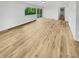 Spacious room featuring hardwood floors, natural light, and an open layout at 9490 E 36Th Pl, Indianapolis, IN 46235