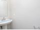 Modern bathroom featuring a pedestal sink, chrome faucet, and tiled walls at 9570 Beckett St, Avon, IN 46123