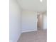 Neutral bedroom with plush carpeting and a modern minimalist design with white trim at 9570 Beckett St, Avon, IN 46123