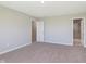 Carpeted bedroom with ample natural light and a hallway bathroom and closet at 9570 Beckett St, Avon, IN 46123