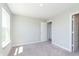Clean bedroom showcasing a window and an open door at 9570 Beckett St, Avon, IN 46123
