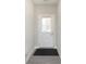 Bright entryway featuring a front door with a window and neutral-toned walls and flooring at 9570 Beckett St, Avon, IN 46123
