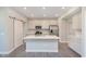 Modern kitchen with a large island, stainless steel appliances, and plenty of cabinet space at 9570 Beckett St, Avon, IN 46123