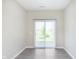 Bright living room featuring a sliding glass door providing backyard views at 9570 Beckett St, Avon, IN 46123