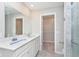 Bathroom featuring a double vanity, bright lighting, and a closet at 9583 Beckett St, Avon, IN 46123