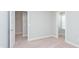 Spacious bedroom with neutral carpet, white walls, and two doors leading to other rooms at 9583 Beckett St, Avon, IN 46123