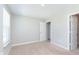 Bedroom with carpet, window, and a door leading into closet, with a second door near the wall at 9583 Beckett St, Avon, IN 46123