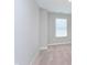 Bedroom featuring neutral carpet, white walls and a single window allowing light into the room at 9583 Beckett St, Avon, IN 46123