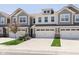 Attractive townhome with a two-car garage and well-maintained landscaping at 9583 Beckett St, Avon, IN 46123