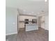 Modern kitchen with white cabinets, stainless steel appliances, and an island at 9583 Beckett St, Avon, IN 46123