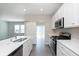 Well-equipped kitchen featuring modern appliances and a sliding door at 9583 Beckett St, Avon, IN 46123