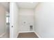 The laundry room with tile floor is ready for a new washer and dryer and has storage at 9583 Beckett St, Avon, IN 46123