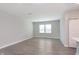 Open-concept living room featuring neutral walls and gray vinyl floors at 9583 Beckett St, Avon, IN 46123