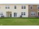 This backyard offers green space with patio, with attached townhomes at 9604 Beckett St, Avon, IN 46123