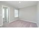 Carpeted bedroom with a window and an open closet at 9604 Beckett St, Avon, IN 46123