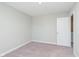 A standard carpeted bedroom with an open closet to the ensuite bath at 9604 Beckett St, Avon, IN 46123