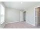 Spacious carpeted bedroom features a window, ensuite bathroom, and walk-in closet at 9604 Beckett St, Avon, IN 46123