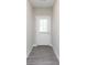 Bright entryway featuring grey wood floors and a white front door at 9604 Beckett St, Avon, IN 46123