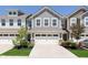 Charming townhome with attached two-car garage and manicured front lawn at 9604 Beckett St, Avon, IN 46123