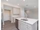 Kitchen island featuring stainless steel appliances and modern white countertop at 9604 Beckett St, Avon, IN 46123