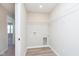Bright laundry room with vinyl floors and a wire shelf at 9604 Beckett St, Avon, IN 46123