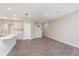 Open concept living room featuring grey wood floors and recessed lighting at 9604 Beckett St, Avon, IN 46123