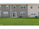 Backyard with green grass and gray siding on building at 9652 Beckett St, Avon, IN 46123