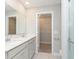 Bathroom featuring double vanity with white counters and cabinets with walk in closet and separate toilet at 9652 Beckett St, Avon, IN 46123