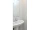 Close-up of a bathroom sink and mirror with a pedestal sink with chrome hardware at 9652 Beckett St, Avon, IN 46123