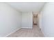 Empty bedroom with carpeted floors, neutral walls, white trim, and hallway at 9652 Beckett St, Avon, IN 46123