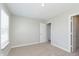 Empty bedroom with neutral walls, carpeted floors, window with blinds, and white trim at 9652 Beckett St, Avon, IN 46123