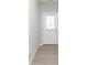 Bright entryway featuring luxury vinyl plank flooring and a modern white door with glass insert at 9652 Beckett St, Avon, IN 46123