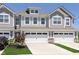 Charming townhome with a two-car garage, well-maintained landscaping, and inviting curb appeal at 9652 Beckett St, Avon, IN 46123