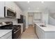 Contemporary kitchen with stainless steel appliances, quartz countertops and modern cabinetry at 9652 Beckett St, Avon, IN 46123