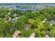 Picturesque aerial view of homes surrounded by trees, highlighting the beautiful community and nearby lake at 9885 Oakleaf Way, McCordsville, IN 46055